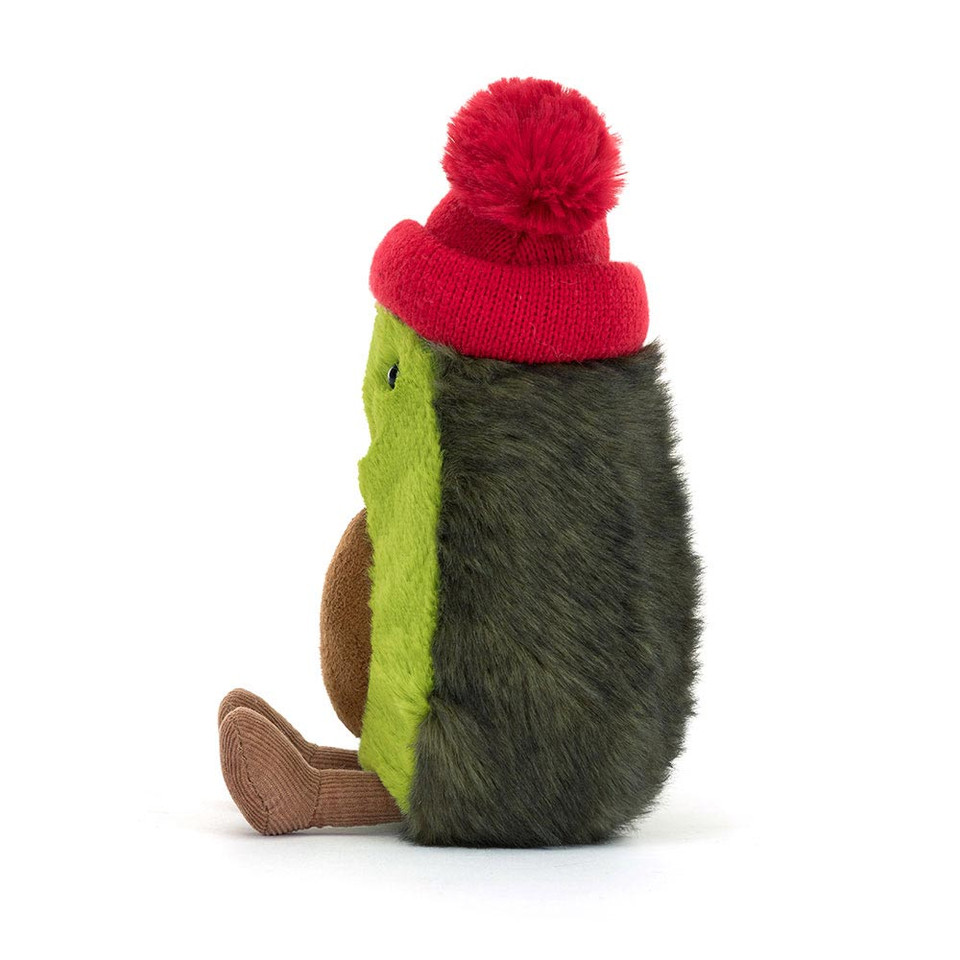 peluche jellycat avocat qui sourit avec un bonnet rouge de côté