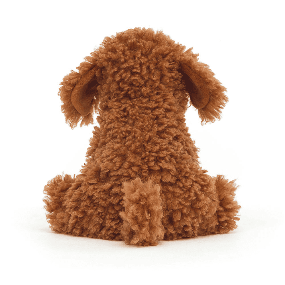 Peluche Chien de dos sur fond blanc 