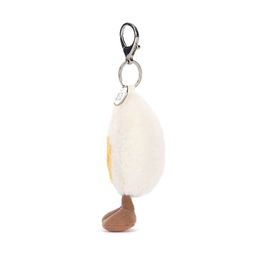 peluche porte clé en forme d'œuf dur de coté sur fond blanc