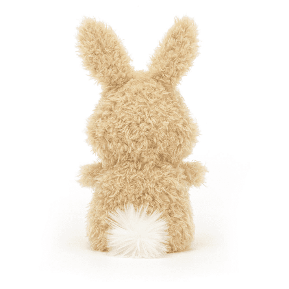 peluche petit lapin de dos sur fond blanc 