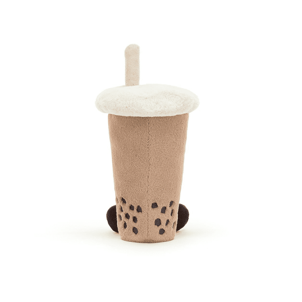 Peluche en forme de boisson bubble tea sur un fond blanc