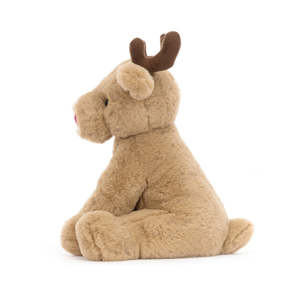 peluche renne avec un nez rouge assis de côté de la marque jellycat