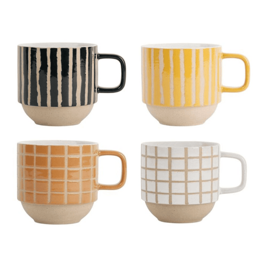 set de 4 tasses à thé de couleur noir jaune orange et blanche sur fond blanc